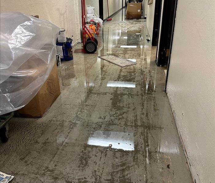 Flooded hallway, water damage cleanup