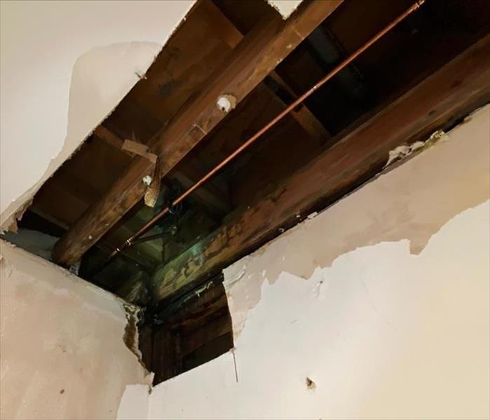 Ceiling pipe burst at commercial residency