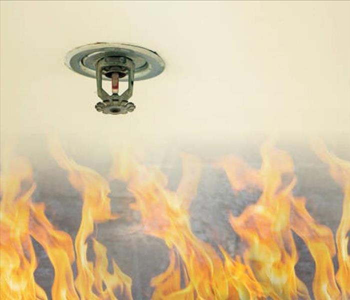 inactive sprinkler head above flames